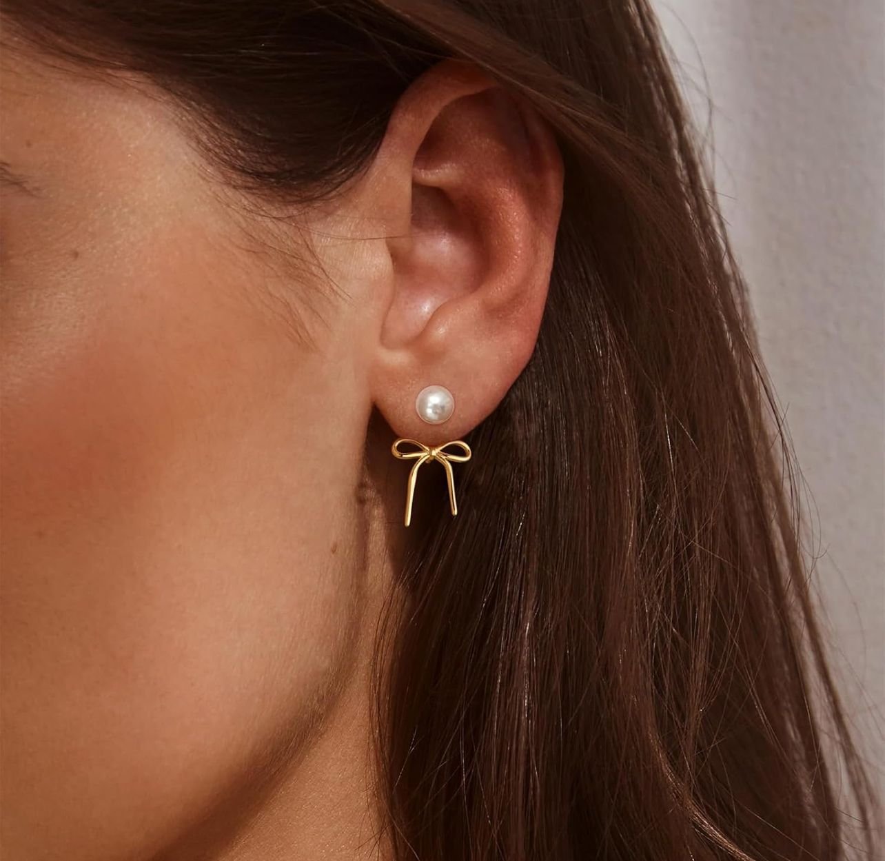 Orecchini pendenti fiocco perla placcati oro